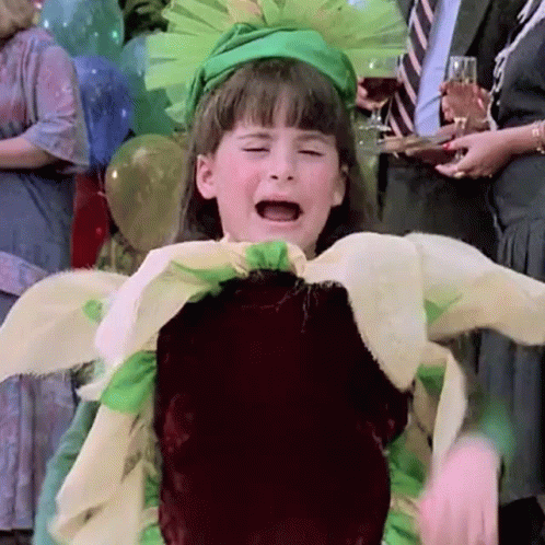 A Little Girl In A Flower Costume Is Crying GIF