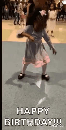 A Little Girl In A Pink Dress Is Dancing On A Dance Floor With The Words `` Happy Birthday '' . GIF