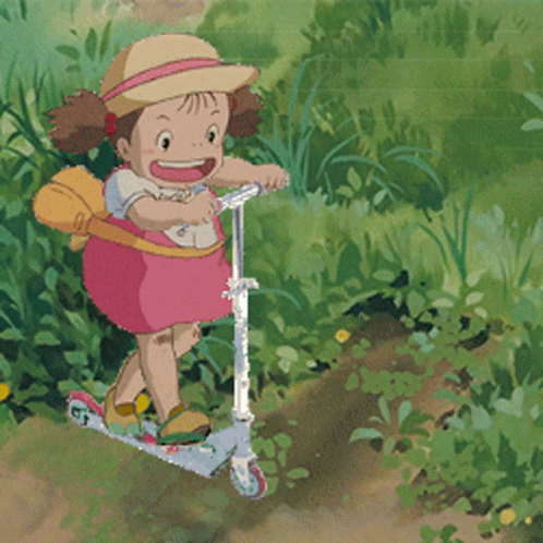 A Little Girl In A Pink Dress Is Riding A Scooter In The Grass GIF
