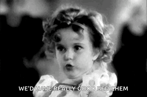 A Little Girl In A Polka Dot Dress Is Talking In A Black And White Photo . GIF
