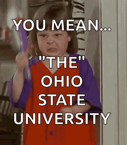 A Little Girl In A Red And Purple Dress Is Holding A Toothbrush And Says " You Mean " GIF