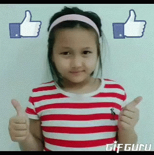 A Little Girl In A Red And White Striped Shirt Is Giving A Thumbs Up GIF