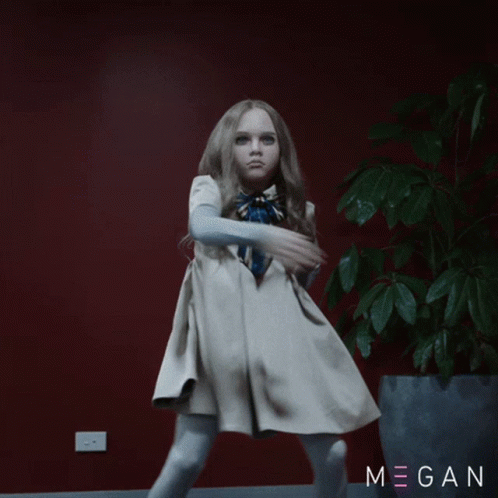 A Little Girl In A White Dress Is Dancing In Front Of A Potted Plant With Megan Written On The Bottom GIF