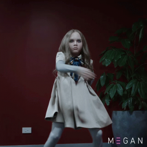A Little Girl In A White Dress Stands In Front Of A Red Wall And A Potted Plant With The Name Megan On It GIF