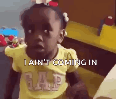 A Little Girl In A Yellow Gap Shirt Is Making A Funny Face And Saying I Ain 'T Coming In . GIF