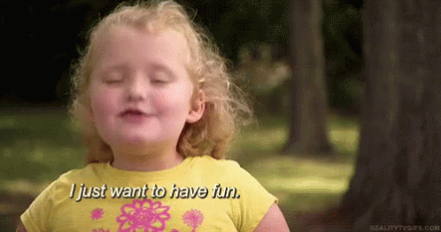 A Little Girl In A Yellow Shirt Is Smiling And Saying `` I Just Want To Have Fun . '' GIF
