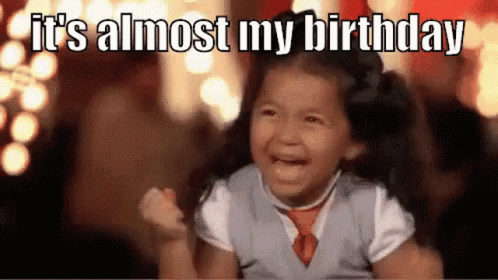 A Little Girl Is Crying While Holding Her Fist In The Air . GIF