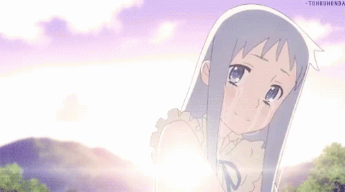 A Little Girl Is Crying With Tears Coming Out Of Her Eyes While Standing In Front Of A Mountain . GIF