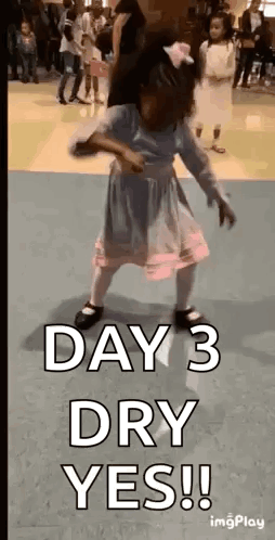 A Little Girl Is Dancing In A Room With The Words `` Day 3 Dry Yes '' . GIF