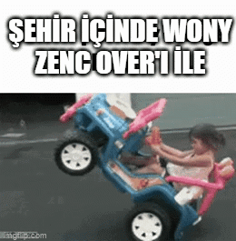 A Little Girl Is Driving A Toy Car With The Words Şehir Icinde Wony Zenc Over I Ile Written On The Bottom GIF