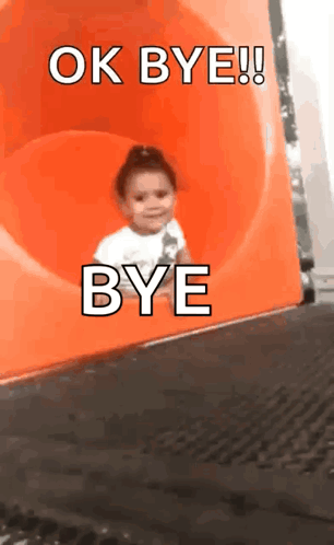 A Little Girl Is Going Down An Orange Slide And Says Ok Bye GIF