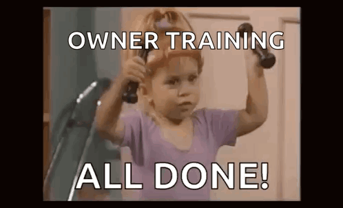 A Little Girl Is Holding A Pair Of Dumbbells Over Her Shoulder . GIF