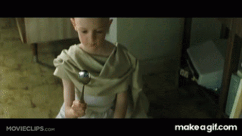A Little Girl Is Holding A Spoon In Her Hand And The Website Says Make A Gif.com On The Bottom GIF