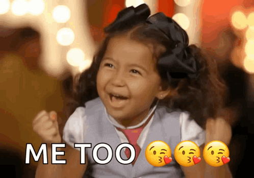 A Little Girl Is Holding Her Fist In The Air With The Words Me Too Written Above Her GIF