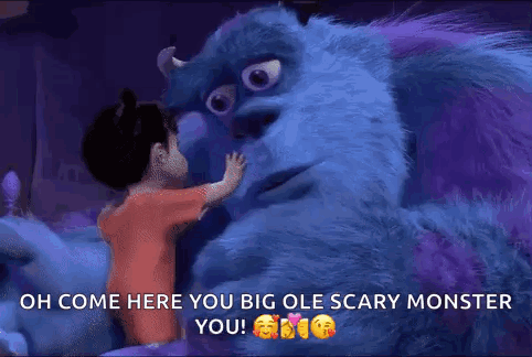A Little Girl Is Hugging A Monster From The Movie Monsters Inc . GIF