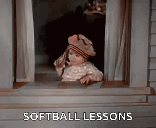 A Little Girl Is Looking Out Of A Window And The Words Softball Lessons Are On The Screen GIF