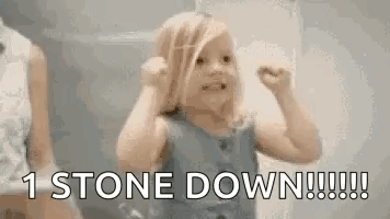 A Little Girl Is Making A Funny Face And Saying `` 1 Stone Down !!! '' GIF