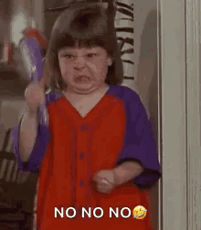 A Little Girl Is Making A Funny Face While Holding A Broom And Making A Funny Face . GIF