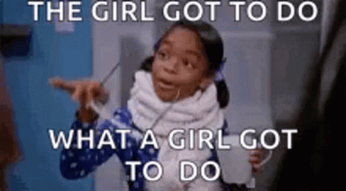 A Little Girl Is Making A Funny Face While Holding A Cup Of Milk . GIF