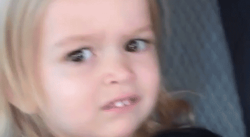 A Little Girl Is Making A Funny Face While Sitting In A Car Seat . GIF