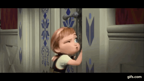A Little Girl Is Peeking Out Of A Door In A Frozen Movie . GIF