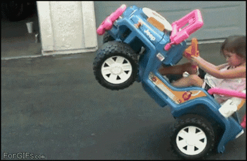 A Little Girl Is Playing With A Toy Jeep That Says Jeep GIF