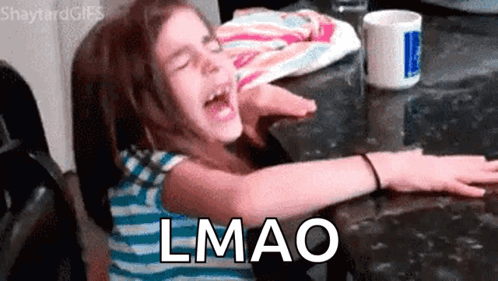 A Little Girl Is Sitting At A Table With Her Arms Outstretched And The Word Lmao Written On The Bottom GIF