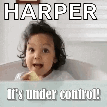 A Little Girl Is Sitting In A Bathtub Eating A Piece Of Food And Making A Face . GIF
