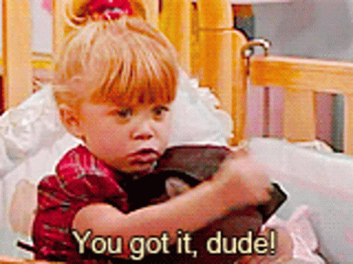 A Little Girl Is Sitting In A Crib And Saying You Got It Dude ! GIF