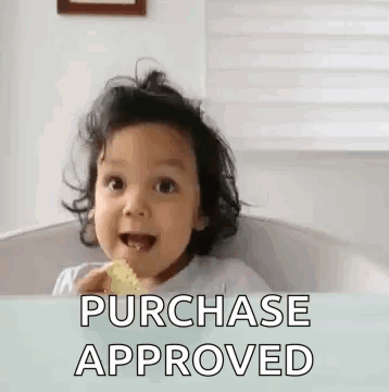 A Little Girl Is Sitting In A High Chair Eating A Snack And Says `` Purchase Approved '' . GIF