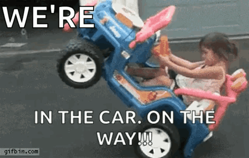 A Little Girl Is Sitting In A Toy Car With The Words We 'Re In The Car On The Way GIF