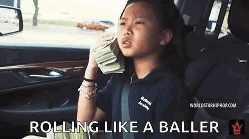 A Little Girl Is Sitting In The Back Seat Of A Car Holding A Pile Of Money . GIF