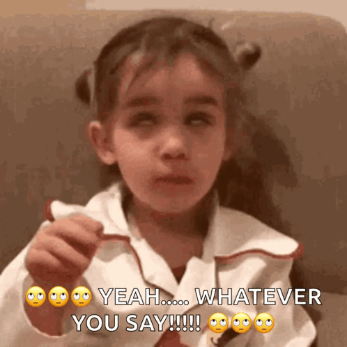 A Little Girl Is Sitting On A Couch And Says Yeah Whatever You Say GIF
