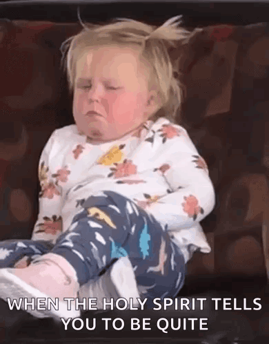 A Little Girl Is Sitting On A Couch With Her Eyes Closed And The Holy Spirit Tells Her To Be Quite . GIF