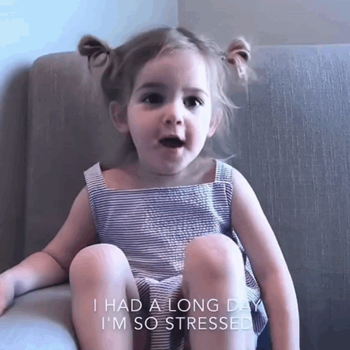 A Little Girl Is Sitting On A Couch With The Words I Had A Long Day I 'M So Stressed GIF