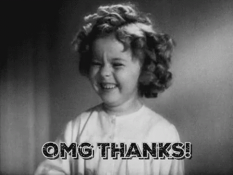 A Little Girl Is Smiling In A Black And White Photo And Saying `` Omg Thanks '' . GIF