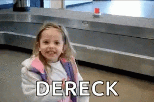 A Little Girl Is Standing In Front Of A Conveyor Belt At An Airport And Smiling . GIF