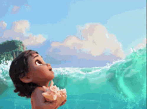 A Little Girl Is Standing In The Ocean Holding A Seashell GIF