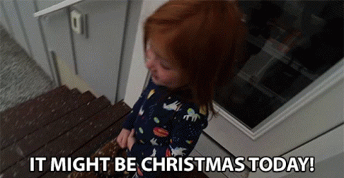 A Little Girl Is Standing On A Set Of Stairs With The Words `` It Might Be Christmas Today '' . GIF