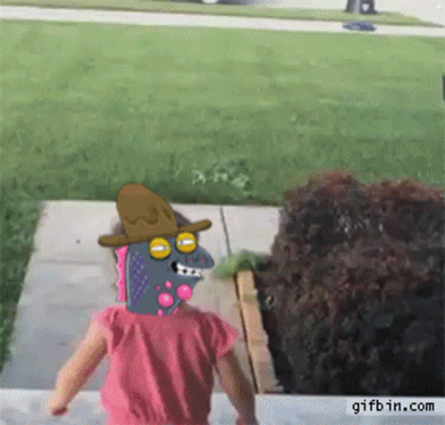 A Little Girl Is Walking Down A Sidewalk With A Cartoon Character On Her Head GIF