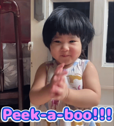 A Little Girl Making A Funny Face With The Words Peek-A-Boo Written Below Her GIF