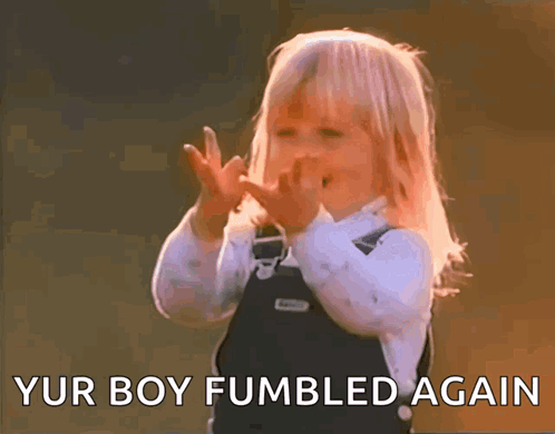 A Little Girl Making A Funny Face With The Words " Yur Boy Fumbled Again " Behind Her GIF
