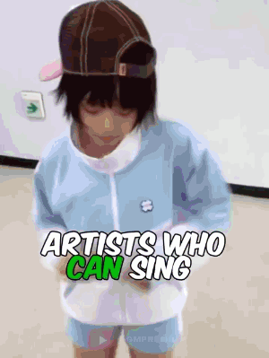A Little Girl Wearing A Hat And A Blue Jacket With The Words Artists Who Can Sing Above Her GIF