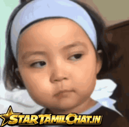 a little girl wearing a headband with a star that says startamlchat.in on it