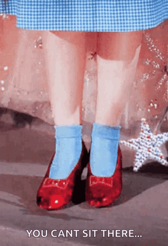 A Little Girl Wearing Red Shoes And Blue Socks Says You Can 'T Sit There GIF