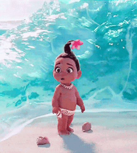 A Little Girl With A Flower In Her Hair Is Standing On A Beach . GIF