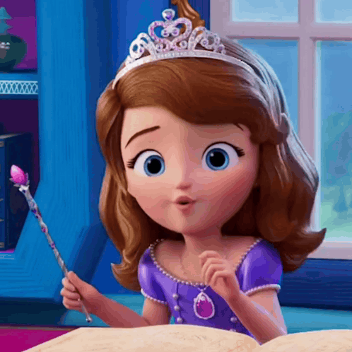 A Little Girl With A Tiara On Her Head Is Reading A Book GIF