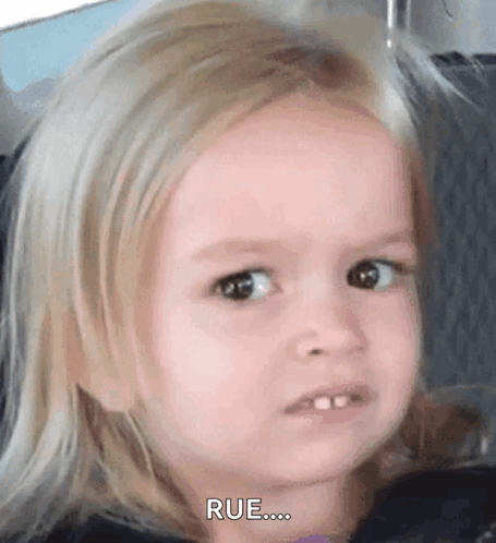 a little girl with blonde hair is making a funny face and saying rue ...