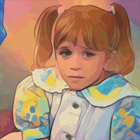 A Little Girl With Pigtails Is Wearing A Blue And Yellow Shirt GIF