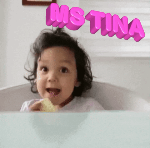 A Little Girl With The Name Justina Written On Her Head GIF
